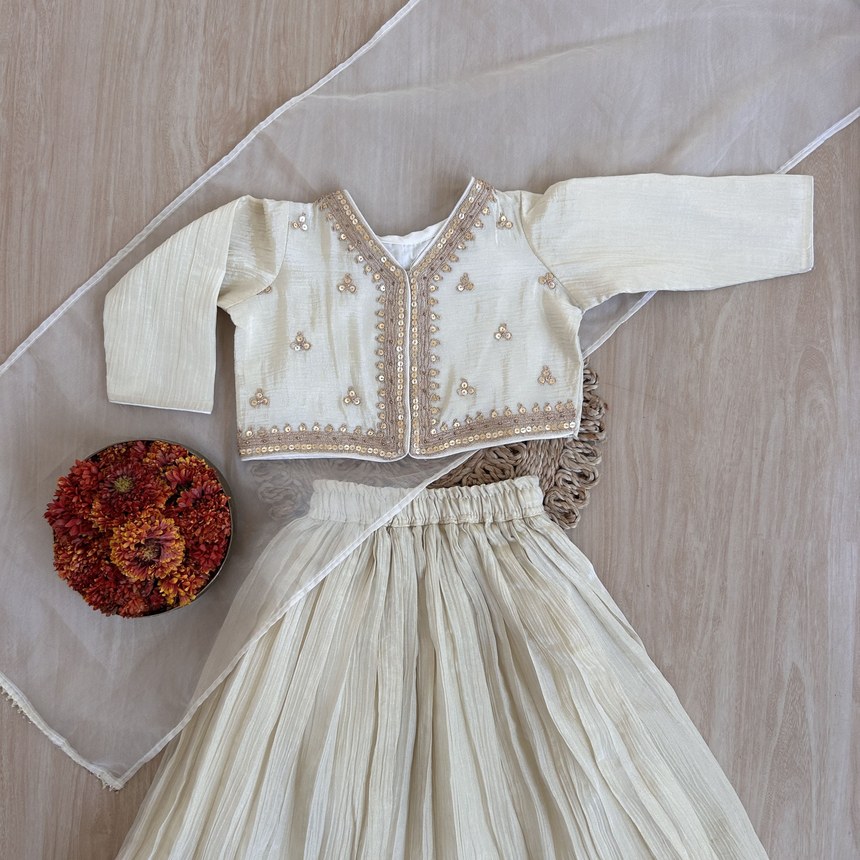 Festive DIRA organic-cotton set styled with marigolds